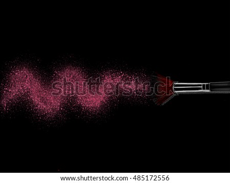 Make up blush brush in pink color with black background