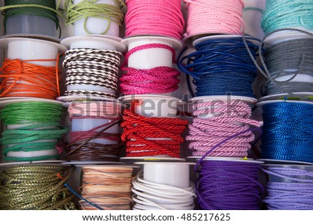 Various  of colorful ropes on coils for kinds creativity, background rainbow