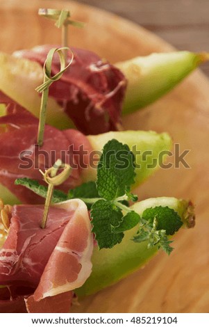 Concept of spanish food with melon and prosciutto
