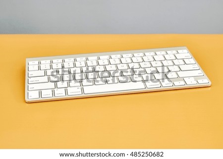 A studio photo of a wireless computer keyboard