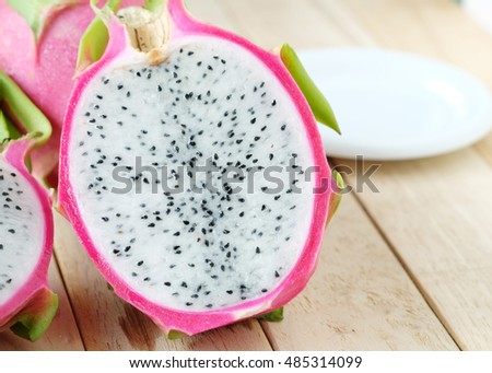 Dragon fruit with copy space on wooden background,Healthy fruit.