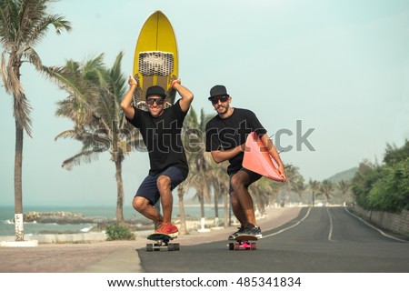Surfers having fun with surfboards on the road
 Royalty-Free Stock Photo #485341834