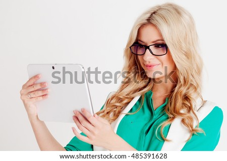 Portrait of young confident business lady, use tablet, white background