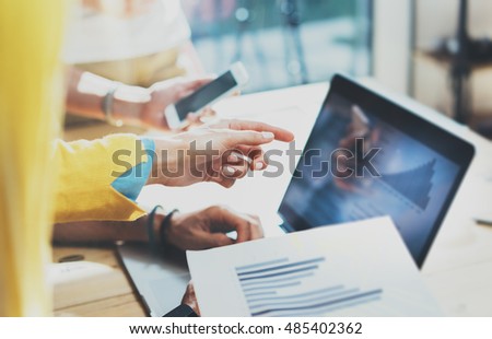 Closeup Young Woman Using Modern Tablet Hand.Hipster Working Great Business Idea Process.Coworkers People Gathered Together Decision Corporate Work.Startup Creative Presentation Concept Blurred
