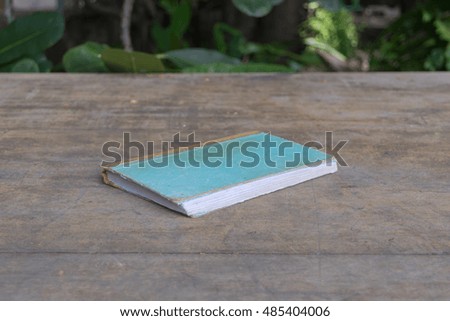 Vintage old Note book on a wood table