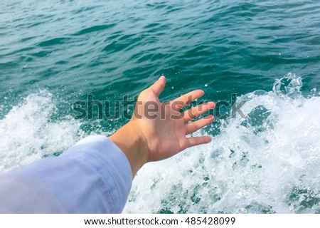Women empty hands, palms on abstract blurred vacation summer ocean beach background - feeling freedom on sea wave