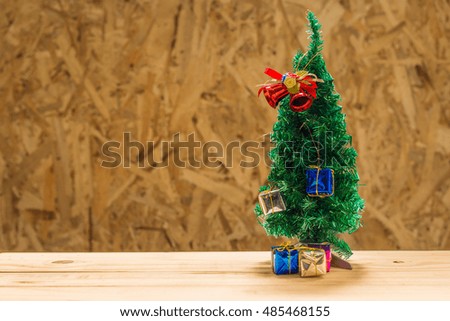 Christmas design - Christmas tree. Background with texture wood with art abstract painting.Holiday card with copyspace.