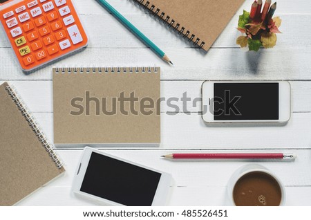 Office stuff and it gadgets display on top view business desk with copy space at text of picture. Filter effect vintage tone film. Creative table, modern project