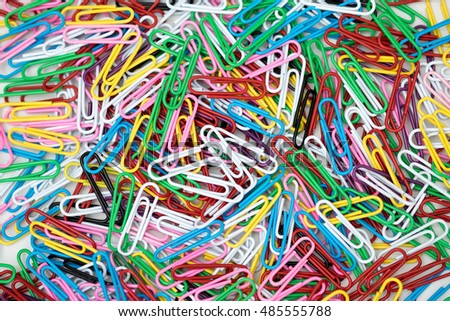 Colorful paper clips on white background.