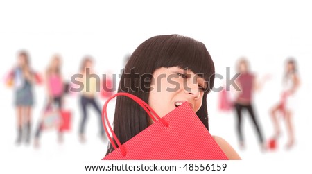 Group of happy cute smiling adult girls with shopping bags
