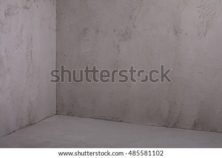 Photo of empty grey concrete room. Background. Wall.