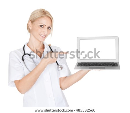Smiling medical doctor woman presenting laptop. Isoalted on white