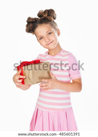 little girl in a smart dress and hairstyle  holding a gift