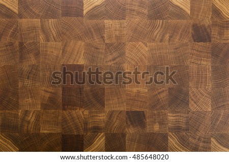 Oak wooden butcher chopping block, natural durable end grain hard wood board texture background pattern close up Royalty-Free Stock Photo #485648020