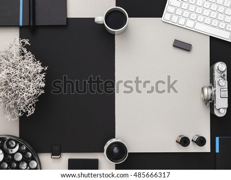Photographer's desk with vintage camera, coffee and keyboard. Modern Grey and black table. Flat lay with copy space.