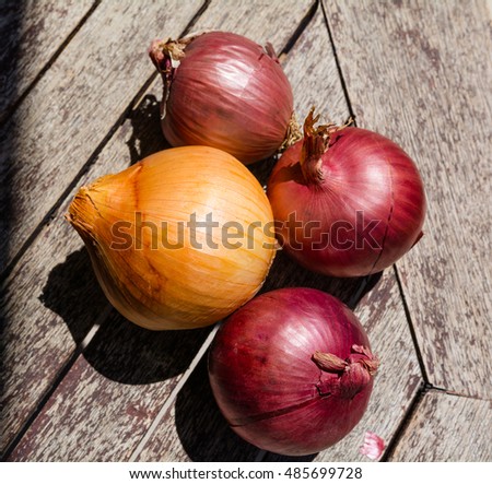 Cooking ingredients: onions on a wooden table