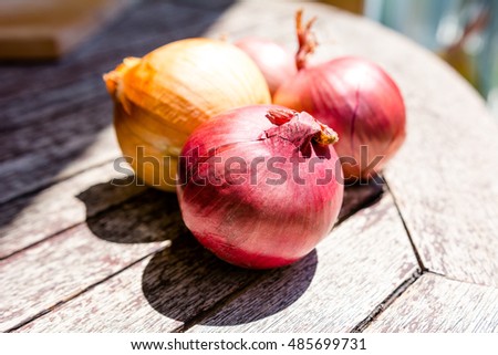 Cooking ingredients: onions on a wooden table