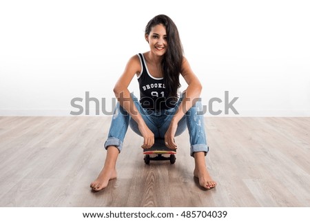 Young cute girl with skate