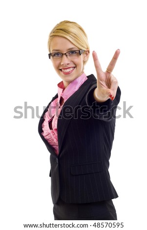 attractive businesswoman making victory sign over white