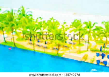 Abstract blur outdoor swimming pool with beach and sea for background
