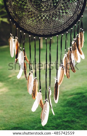 Native american folk indian mystical decoration handmade dreamcatcher made with feather for good sleep and positive thinking