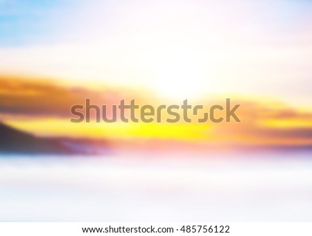 Blur peaceful landscape sunset. Colorful pink blur glowing bokeh and blue sky. Soft focus view nature. Abstract background Orange and purple gradient. Sunbeam summer rays light sandy. White smog,fog.