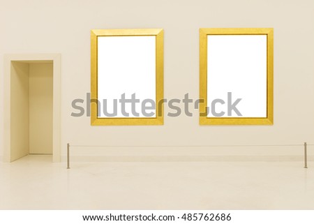 wooden golden photo frames on wall in exhibition gallery