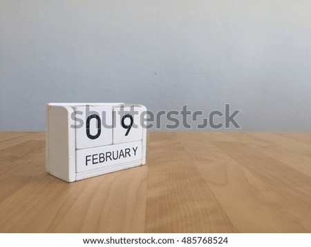 February 9th.February 9 white wooden calendar on vintage wood abstract background.Winter time. Copyspace for your text.