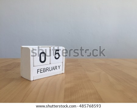 February 5th.February 5 white wooden calendar on vintage wood abstract background.Winter time. Copyspace for your text.