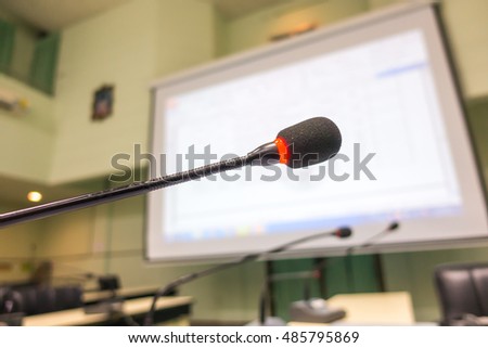 Black microphone in conference room ( Filtered image processed vintage effect. )