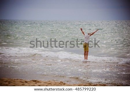 boy jumping in the sea 