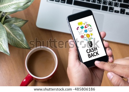 CASH BACK Thoughtful male person looking to the digital phone screen,Silhouette top computer and hand Royalty-Free Stock Photo #485806186