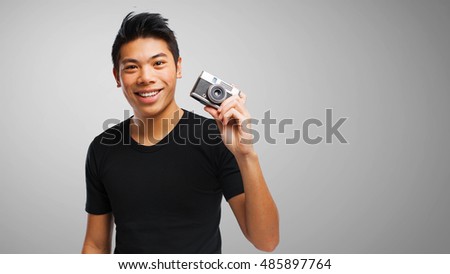 chinese man with a camera