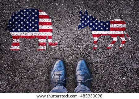 Legs on asphalt road with elephant and donkey, american election concept Royalty-Free Stock Photo #485930098