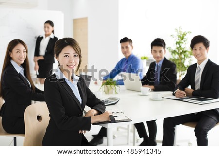 Group of happy young business people in  meeting Royalty-Free Stock Photo #485941345