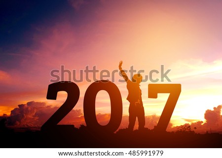 Silhouette young man Happy for 2017 new year Royalty-Free Stock Photo #485991979