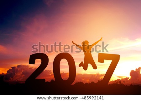Silhouette young woman jumping to 2017  new year Royalty-Free Stock Photo #485992141