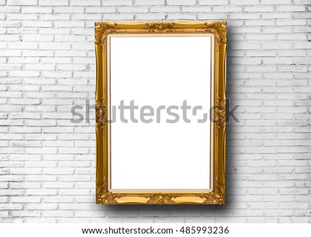 Gold picture frame hanging on the wall 
