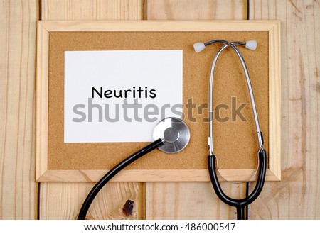 Words Neuritis With Stethoscope On Wooden Background. ( Medical Concept )
