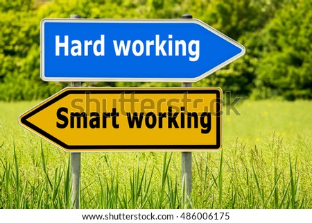Smart Working - Hard Working text on Yellow road signs and blue arrow  highway directions signs  on green field background. Signposts, different directions