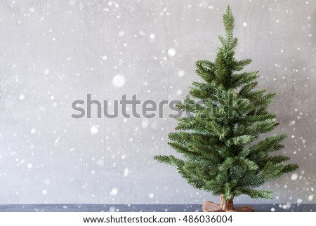 Christmas Tree With Cement Wall As Background, Snowflakes, Copy Space