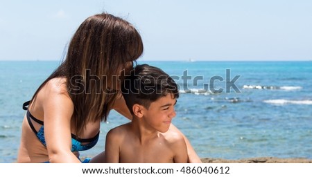 Mother and son in a beach