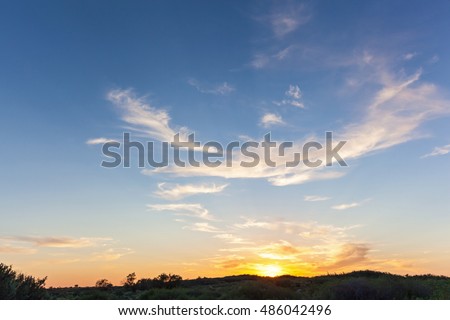 Golden sunset.Golden beautiful sunset on the horizon  and blue sky with clouds. 