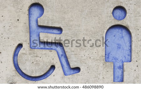 Toilet sign of men and people with disabilities   on concrete in park