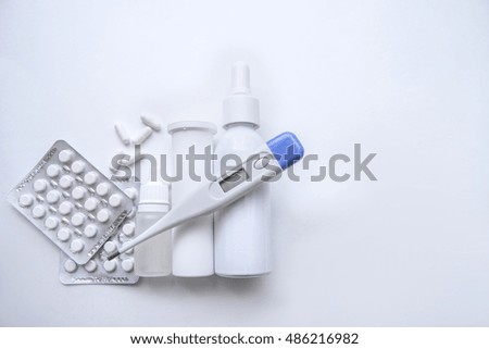 antibiotic, pills and thermometer isolated