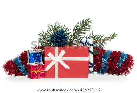 New year gifts with fir-tree toys and garland over white background