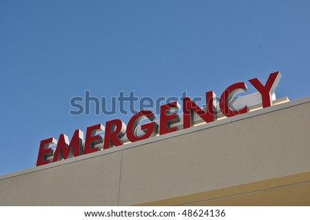 Red Hospital Emergency Sign with Blue Sky