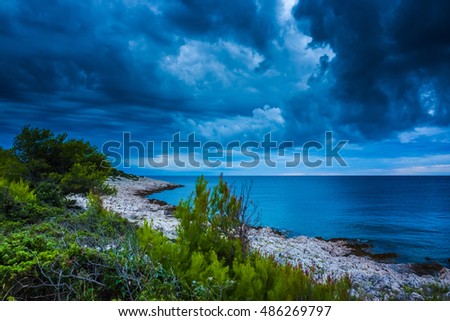 Seascape Razanj Croatia Europe. Beautiful nature and landscape photo of Adriatic Sea in Dalmatia. Lovely summer evening. Storm clouds in sky. Colorful fine art picture. Nice, calm and joyful image.
