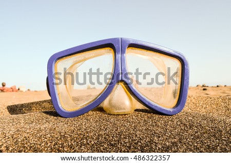 Photo Picture of a Diving Mask on the Sand Beach