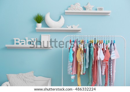 Shelves with hanger in modern baby room